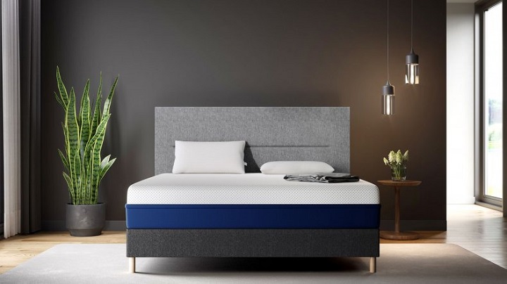 bed with a blue and white firm mattress