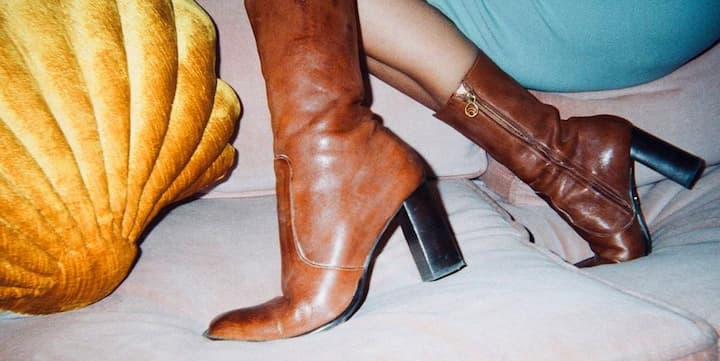 Women practice wearing high heel boots