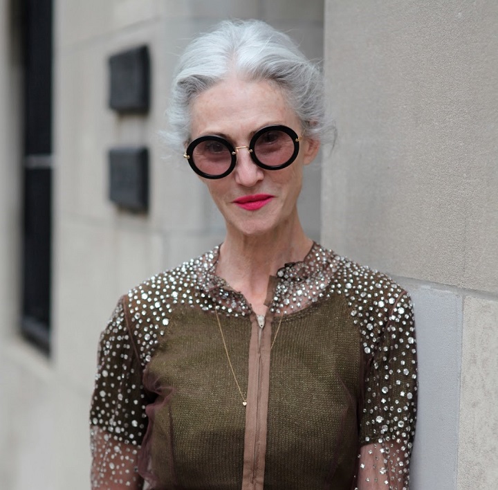 woman in her late 50s wearing fashionable sunglasses 