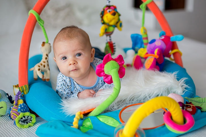 baby playing in play mat 