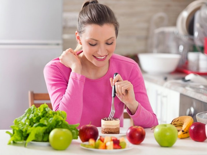 woman eating healthy vegan dessert 