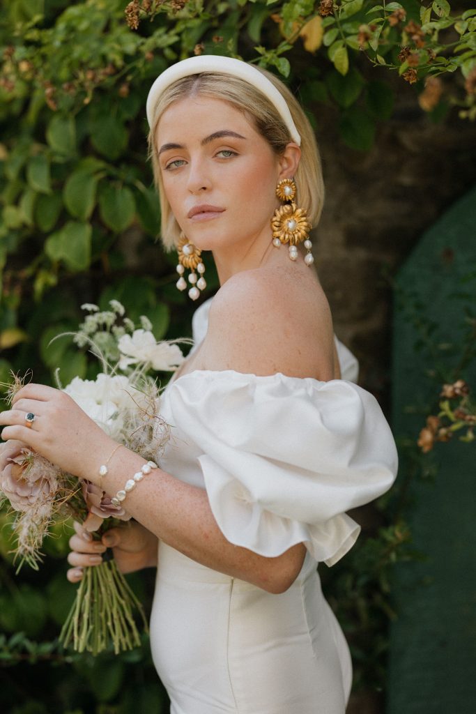 bride with short hair and headband and earrings