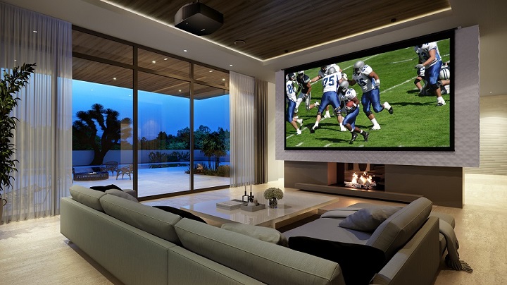 picture of a livingroom with football on a home projector screen tv