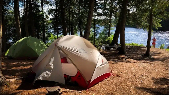 2 person tents in lake
