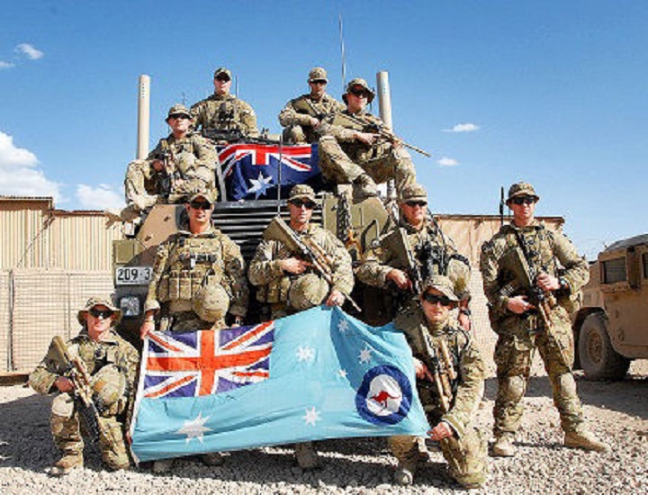 air force holding australian defence flag 
